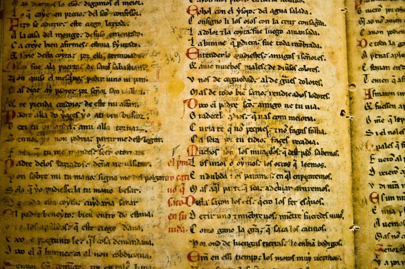 Handwritten writing on the open pages of an old book .