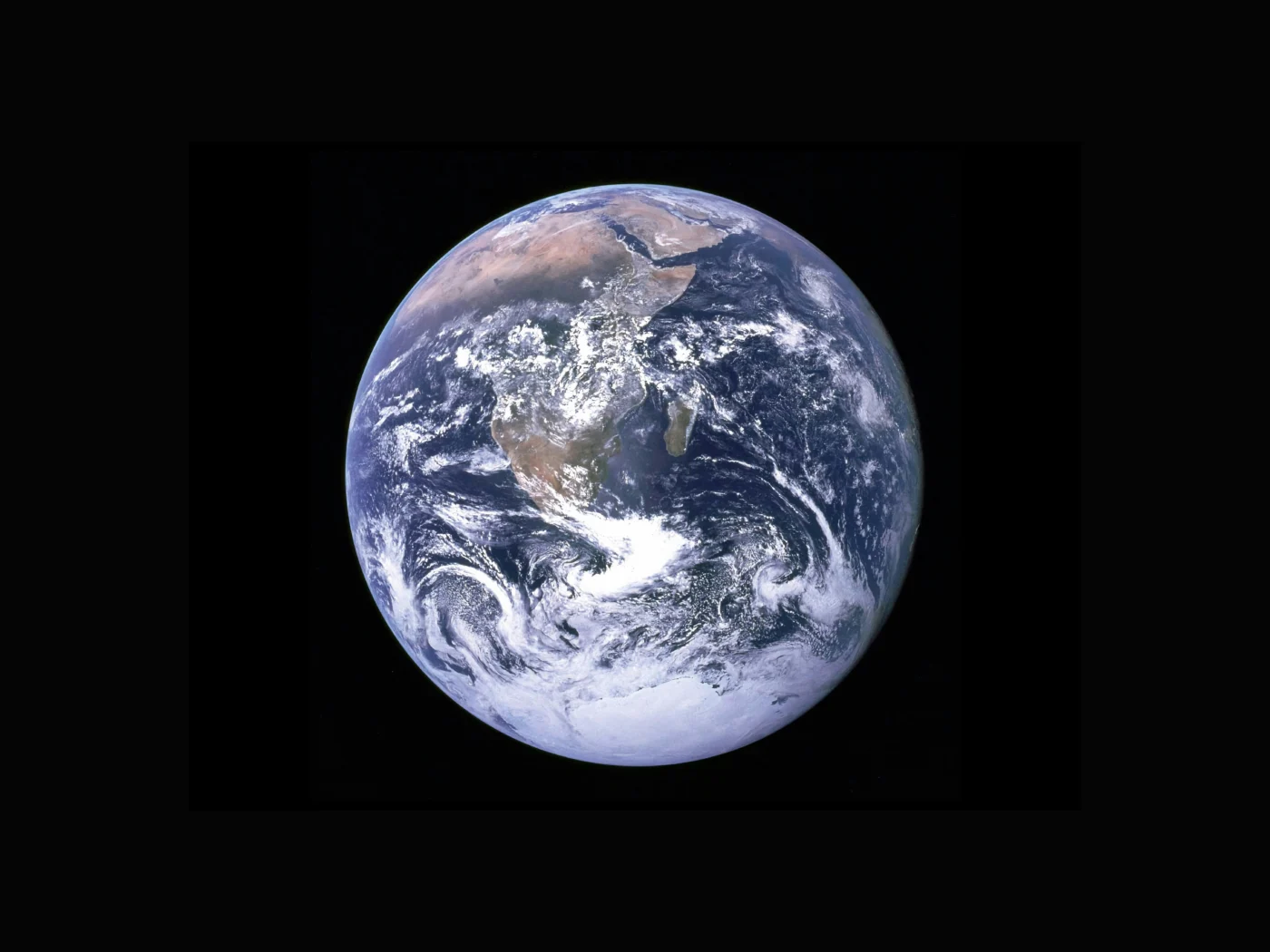 View of the Earth with clouds above the African continent as seen by the Apollo 17 crew travelling toward the moon.